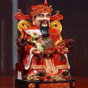 Tượng Thần Tài với nụ cười tươi và thỏi vàng